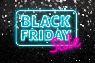 Text BLACK FRIDAY SALE on dark background with glitters