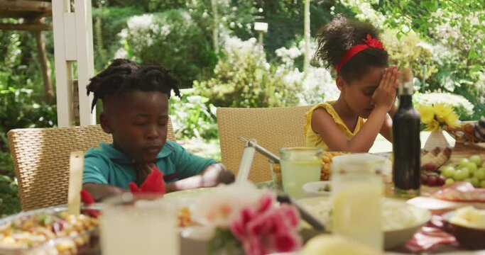 African American family spending time in garden together