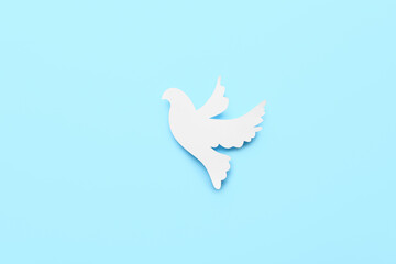 Paper dove on color background. International Day of Peace