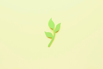 Paper olive branch on color background. International Day of Peace
