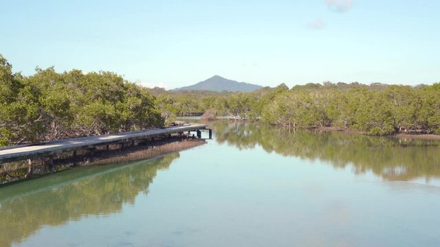 Urunga boardwalk mountain view in New South Wales in Australia