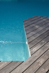 blue pool beach detail for swimming pool with exotic wooden terrace
