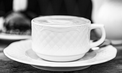 Loving coffee. Cup of fresh cappuccino. Cappuccino in a cup, hot latte, delicious coffee. Coffe time