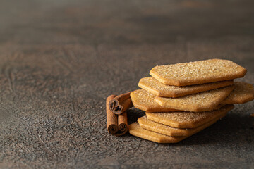 Cinnamon sugar  crackers  sack and cinnamon sticks on concrete background. Copy space