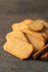 Cinnamon sugar  crackers  and cinnamon sticks on concrete background. Copy space