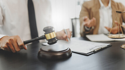 Counselor with legal documents discussing with client about legacy case.