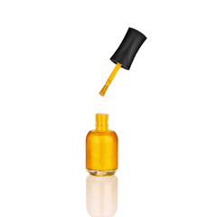 Golden glittering nail polish open glass bottle & brush white background isolated close up, gold color varnish, bright shiny yellow lacquer, sparkling enamel, beautiful shimmer gel, cosmetic accessory