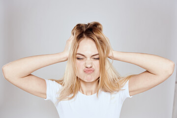 Fototapeta premium emotional blonde white t-shirt close-up studio lifestyle fun