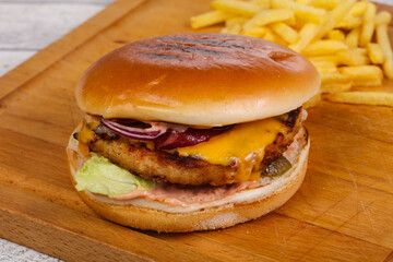 Burger with chicken, cheese and red onion