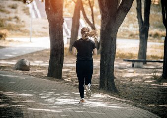 Girl makes a run to the summer Park
