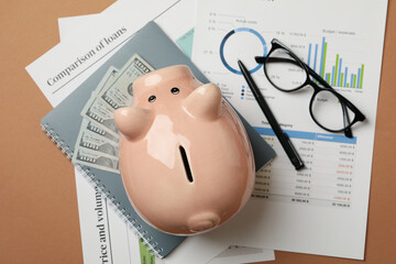 Concept of financial planning with piggy bank on craft background