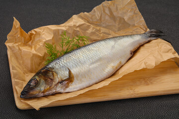 Salted herring over the wooden board