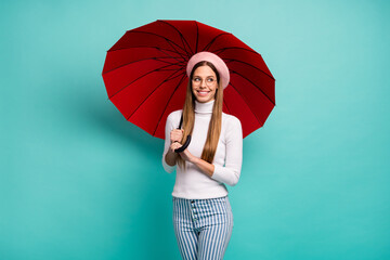 Photo of pretty dreamer traveler lady hold big red umbrella walk street abroad good mood wear specs...