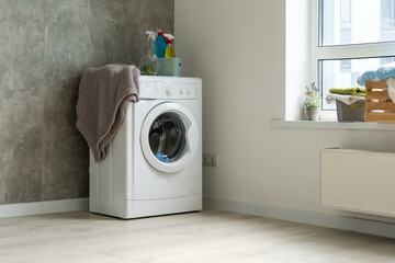 Contemporary luxury laundry in a brand new apartment in white.
