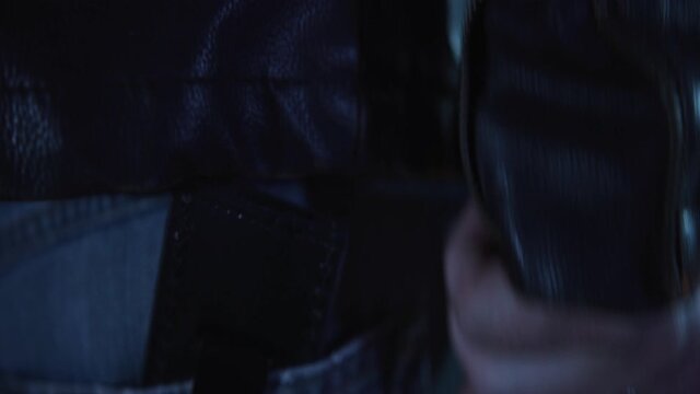 Biker Man Grabs Knife Out of Sheath at Night, Extreme Close Up, Static