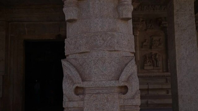 Archeology, stone column with carved images in the ancient temple of the Indian city of Hampi