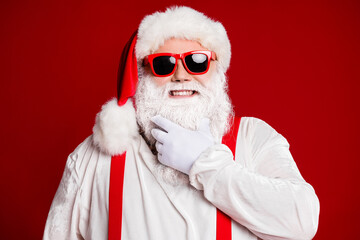 Close-up portrait of his he attractive confident cheerful cheery white-haired Santa father touching beard celebratory isolated over bright vivid shine vibrant red burgundy maroon color background