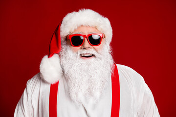 Close-up portrait of his he attractive cheerful cheery Santa father having fun Eve Noel day isolated over bright vivid shine vibrant red burgundy maroon color background