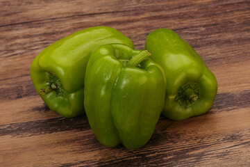 Three green bell juicy peppers