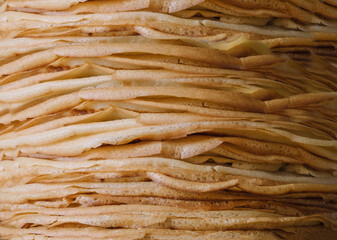 close up macro shoot of thin pancakes , texture of fried thin pancakes