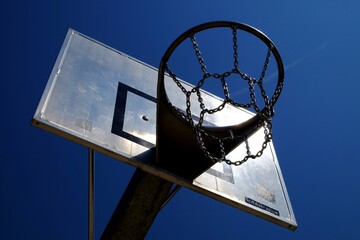 basketball hoop against blue sky - 387091011