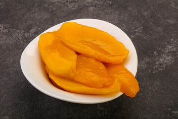 Sweet mango slices in syrop