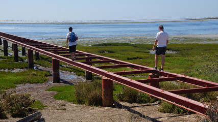 Young Man walking to the beach 