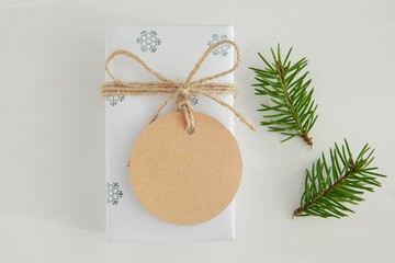 Kraft gift tag mockup, blank thank you tag on Christmas gift box, name label mock up.