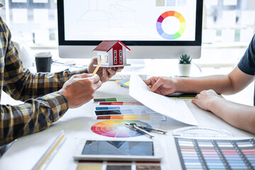 Team design of young Interior graphic designer working house project sketching on graphic tablet...