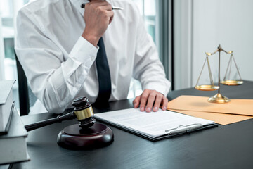 Male lawyer working with legal case document contract in office, law and justice, attorney, lawsuit concept