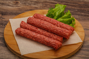 Raw beef sausages with spices