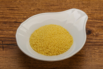 Raw cous cous heap in the bowl
