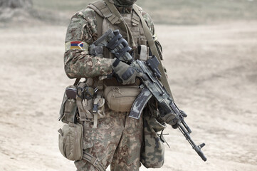 Soldier with assault rifle and flag of Artsakh and also known as Nagorno-Karabakh Republic. Collage.