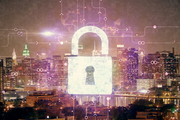 Lock icon hologram on city view with skyscrapers background multi exposure. Data security concept.