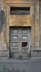 Very old wooden door. Ancient building. Old architecture. Ust-Kamenogorsk (Kazakhstan). 2020.