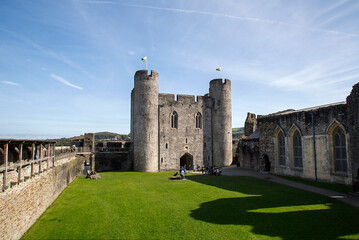 Fototapeta na wymiar Caerphilly Castle is a medieval fortification in Caerphilly in South Wales. The castle was constructed by Gilbert de Clare in the 13th century as part of his campaign to maintain control of Glamorgan