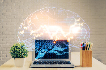 Double exposure of desktop with computer and brain drawing hologram. Artificial intelligence...