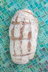 Freshly baked bread on patterned surface