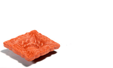 Close up of a beautifully designer handmade clay lamp isolated on white background