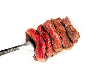 
Different degrees of doneness of steak on a fork for meat on a white background