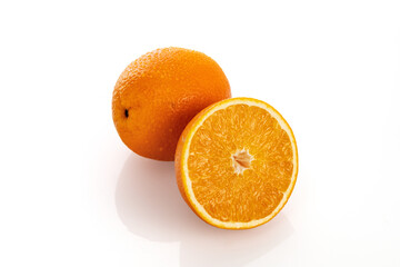 Juicy orange with a half on a white background, isolate, close-up