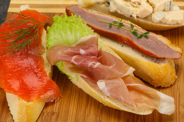 Tapas - bruschetta with prosciutto, salmon, duck and gorgonzola