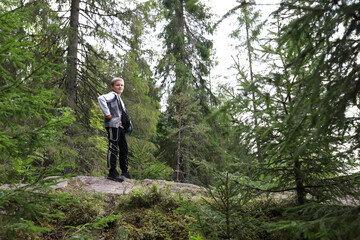 Boy posing in summer forest