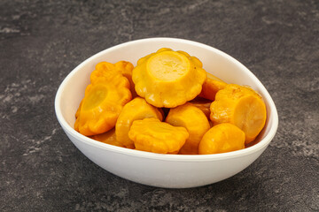Marinated yellow patisson in the bowl
