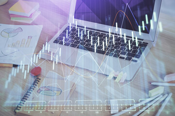 Double exposure of forex chart and work space with computer. Concept of international online trading.