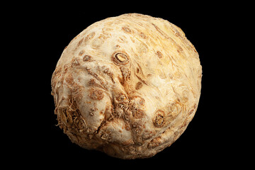 Round celery root on black