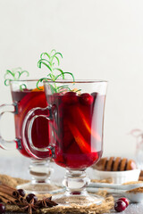 Christmas Hot mulled wine in glasses with orange slices and cranberry.