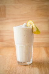 Banana Fruit shake with a piece of banana on top for décor
