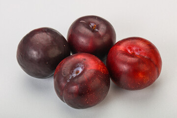 Ripe sweet plum fruit heap