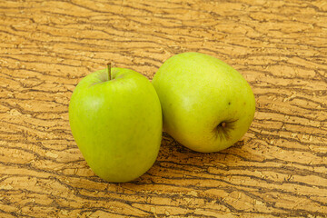 Two ripe green sweet apples